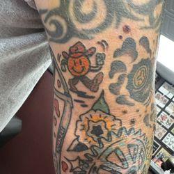 Genuine Electric Tattoo - Everything but the tribal tattoo is drawn and tattooed by Wyatt.