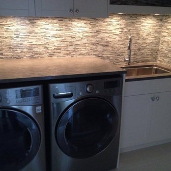 Vancouver City Plumbing - a washer and dryer in a laundry room - Plumbing Near Me Vancouver City Plumbing - a washer and dryer in a laundry room - Plumbing Near Me