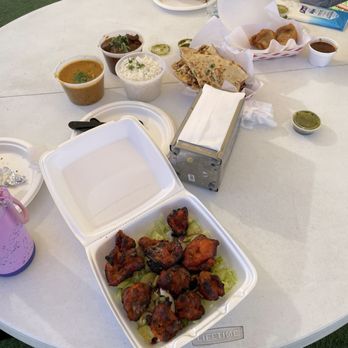 Royal Indian Cuisine - a table with a variety of food items - Indian Near Me - Bakersfield, California Royal Indian Cuisine - a table with a variety of food items - Indian Near Me - Bakersfield, California