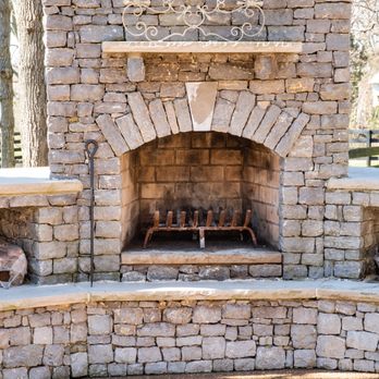 Burlap and Bloom - a brick fireplace in a park - Landscaping Near Me Burlap and Bloom - a brick fireplace in a park - Landscaping Near Me