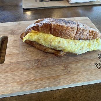 Carmela Coffee - my croissant with egg, cheese, and bacon. - Cafes Near Me - Pompano Beach, Florida