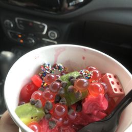 a person holding a bowl of fruit a person holding a bowl of fruit