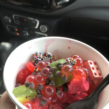 Yogurtology - a person holding a bowl of fruit - Ice Cream & Frozen Yogurt Near Me - Tampa, Florida Yogurtology - a person holding a bowl of fruit - Ice Cream & Frozen Yogurt Near Me - Tampa, Florida