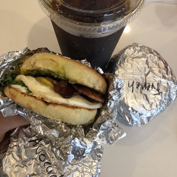 Vinal Bakery - GOAT breakfast sandwich on Jalapeño corn English muffin with bacon & Iced coffee - Cafes Near Me - Somerville, Massachusetts