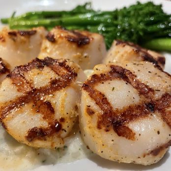 Seasons 52 - Caramelized Grilled Sea Scallops with broccolini and risotto. - New American Near Me - Altamonte Springs, Florida