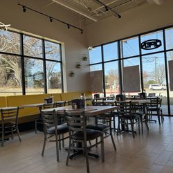 Ample Tables and chairs for seating in a light and roomy atmosphere
