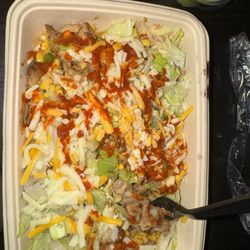 SOL Mexican Grill - chicken, yellow rice, black beans, lettuce, corn salsa,  and cheese