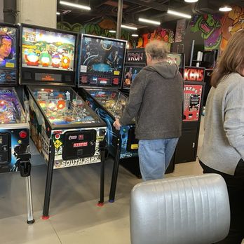 GameOn bar+arcade - Hubby playing Tron - Bars Near Me - Columbia, Maryland