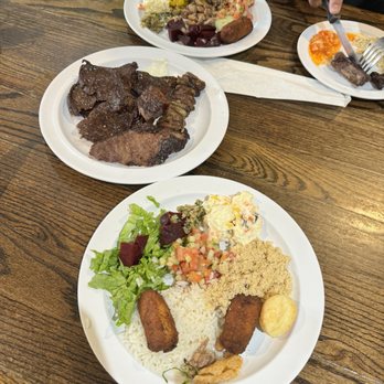 Porto Brasil - three plates of food on a wooden table - Brazilian Near Me - Sandy Springs, Georgia Porto Brasil - three plates of food on a wooden table - Brazilian Near Me - Sandy Springs, Georgia