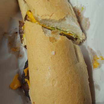 Vucinovich's Restaurant - Hot Sausage Po Boy with Added American Cheese - Cajun/Creole Near Me - New Orleans, Louisiana