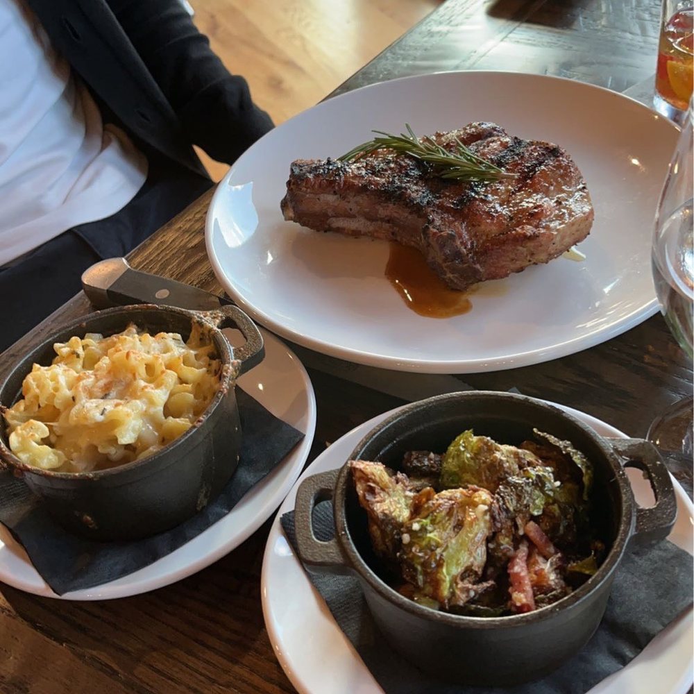 Pork chop with mac n cheese and brussel sprouts. Pork chop with mac n cheese and brussel sprouts.