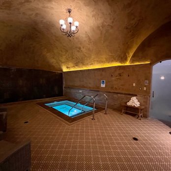 Spa Terra - Jacuzzi in front of a waterfall wall and steam room (right) - Day Spas Near Me - Napa, California
