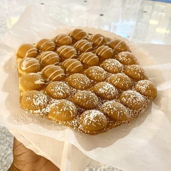 Ball Ball Waffle - 19 May 2024 -- Traditional ball ball waffle ($7) with one side powdered sugar and other side topped with condensed milk - Hong Kong Style Cafe Near Me - Cleveland, Ohio