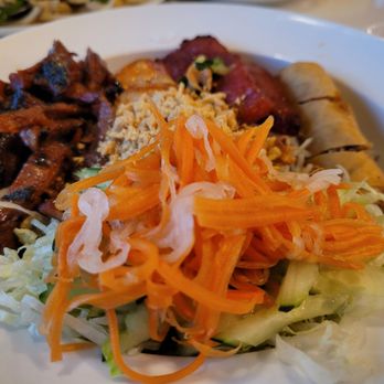 Pho Viet Augusta - Bun (rice noodles salad) with grilled pork, shrimp, Vietnamese sausage and fried spring roll. I appreciated the crispy galic and  peanuts. - Vietnamese Near Me - Augusta, Georgia