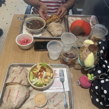 La Panaderia Bakery Cafe - grilled chicken birote torta & chorizo and egg birote torta (across table) - Bakeries Near Me - San Antonio, Texas