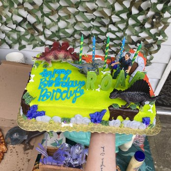QFC - a person holding a birthday cake - Grocery Near Me - North Bend, Washington QFC - a person holding a birthday cake - Grocery Near Me - North Bend, Washington