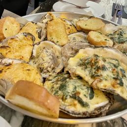 Oyster Trio 4 Rockefeller - spinach cream sauce 4 Cajun - pimento cheese 4 Garlic Herb & Parmesan