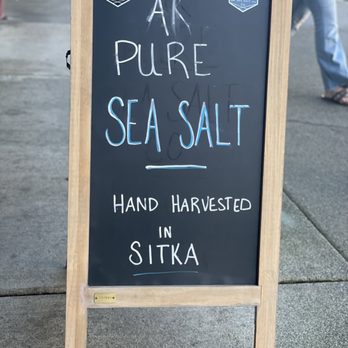 Alaska Pure Sea Salt - a chalkboard sign on a sidewalk - Specialty Food Near Me - Sitka, Alaska