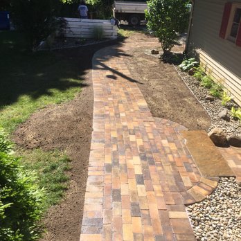 Penning Landscape Services - a brick walkway being laid - Landscaping Near Me Penning Landscape Services - a brick walkway being laid - Landscaping Near Me