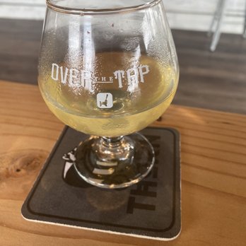 Over The Tap - a glass of beer on a coaster - Beer Bar Near Me - National City, California