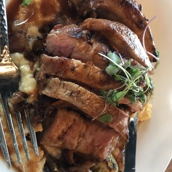 Hickory & Ash - Pork chop over grits - Steakhouses Near Me - Broomfield, Colorado Hickory & Ash - Pork chop over grits - Steakhouses Near Me - Broomfield, Colorado
