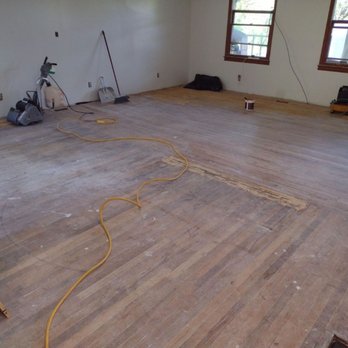 Recovery Restoration - a room with a hard wood floor - Damage Restoration Near Me Recovery Restoration - a room with a hard wood floor - Damage Restoration Near Me