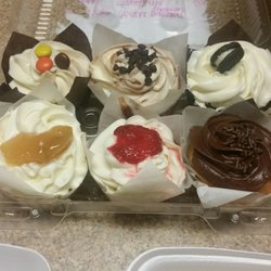 Jarets Stuffed Cupcakes - Left/right, top/bottom: Phone Home, Cookie Monster (my favorite), Outrageous Oreo, Apple Annie, Strawberry Blonde, Mom's Favorite. Un-real!