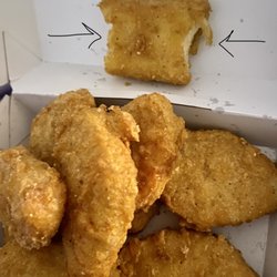McDonald's - Did they sell me a half eaten nugget? I don't buy the "manager" story about a spoon doing this. Unsanitary!