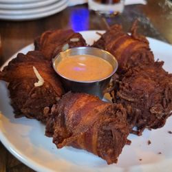 Rowley Inn - Bacon-wrapped tater tots with Chipotle ranch dressing