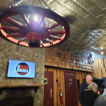 The Barn Dinner Theatre - Wagon wheel of light heading to the barn ambience. - Performing Arts Near Me - Greensboro, North Carolina