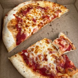 a half eaten pizza in a box