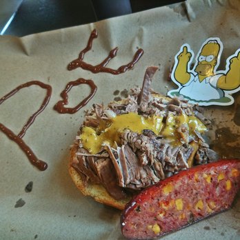 Mission BBQ - Brisket Sandwich topped with Talladega Sauce n link of Jalapeño Cheddar Sausage - Barbeque Near Me - Troy, Michigan Mission BBQ - Brisket Sandwich topped with Talladega Sauce n link of Jalapeño Cheddar Sausage - Barbeque Near Me - Troy, Michigan