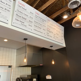 Coned Pizza - menus above counter in restaurant - Food Trucks Near Me