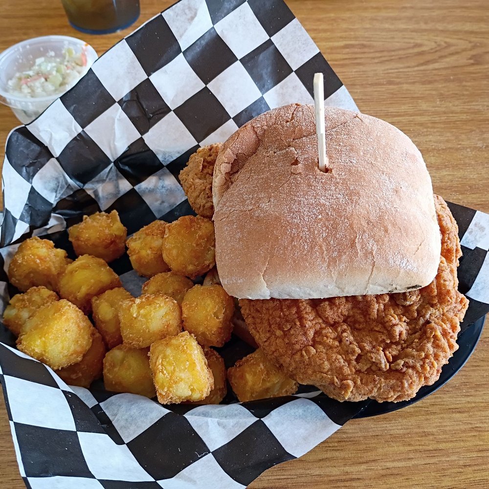 Fluffy's - Pork tenderloin sandwich with tater tots - Breakfast & Brunch Near Me - Winter Haven, Florida Fluffy's - Pork tenderloin sandwich with tater tots - Breakfast & Brunch Near Me - Winter Haven, Florida