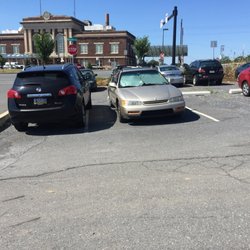 Parking Lot across from Amtrak - Do not be an inconsiderate meanie like this black Nissan driver.