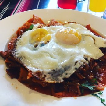 Mi Pueblito - GET THIS!  Chilequiles de carne enchilada de puerco Salsa rojo  (Spicy pork chilequiles with red sauce) ....with two fried eggs on top. - Mexican Near Me - Kearny, New Jersey