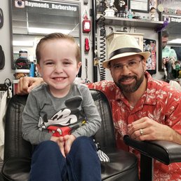 Javier just finished Elijah's haircut. Javier just finished Elijah's haircut.