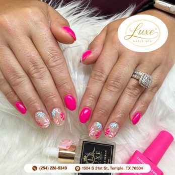 Luxe Nails & Spa - Radiant hot pink nails with colorful hand-painted daisy accents. Bring a pop of joy to your fingertips.  Book your appointment! - Nail Salons Near Me - Temple, Texas