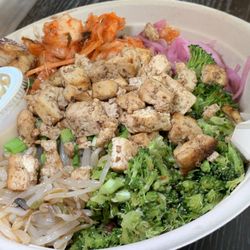 CoreLife Eatery - Tofu, Rice Noodles, Rice, Spicy Broccoli, Kimchi, Bean Sprouts, Pickled Red Onions, Green Onions, Miso Sesame Ginger Dressing (Vegan).