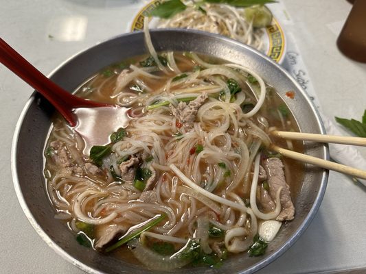 Photo of Vietnam Kitchen - Louisville, KY, US. B1. Pho Tai : Beef Pho with onions, rice noodles, sliced beef, green onions, mint and cilantro