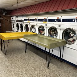 Barlow's Coin Laundry - We had to push the table's against the dryer doors so they would stay closed. This was ridiculous.