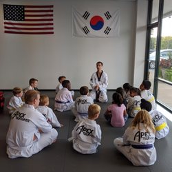 Apex Taekwondo Center - Students demonstrating focus by listening
