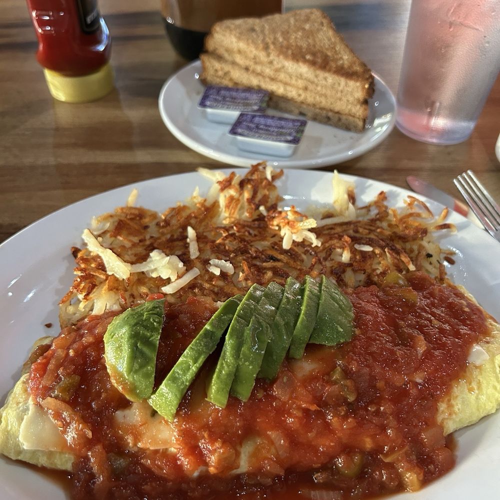 Southwest Omelet $14.74 Avocado, Black beans, Red pepper, and Pepper jack cheese, topped with Salsa. Ordered the hash browns extra crispy. Southwest Omelet $14.74 Avocado, Black beans, Red pepper, and Pepper jack cheese, topped with Salsa. Ordered the hash browns extra crispy.