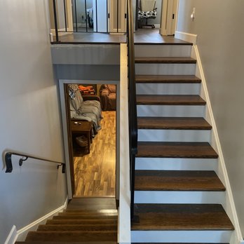 CM Floor and Tile - a staircase leading to a living room - Flooring Near Me CM Floor and Tile - a staircase leading to a living room - Flooring Near Me