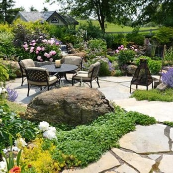 Pathways To Perennials - a patio with a table and chairs - Landscaping Near Me - King, Ontario Pathways To Perennials - a patio with a table and chairs - Landscaping Near Me - King, Ontario