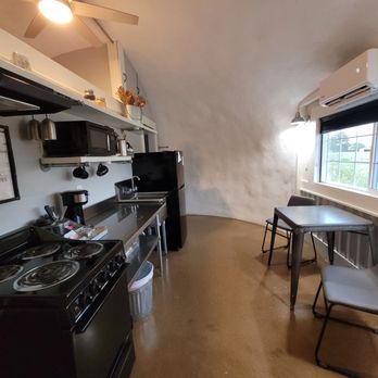 Country Dome Suites - Full kitchen in every suite -- stove, fridge, coffee bar, and dining space at Country Dome Suites. - Hotels Near Me - Bellville, Texas Country Dome Suites - Full kitchen in every suite -- stove, fridge, coffee bar, and dining space at Country Dome Suites. - Hotels Near Me - Bellville, Texas
