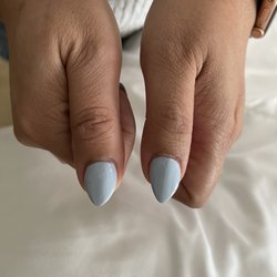 Luxury Nails II - All the nails in this photo have a very prominent slant to the left. They are not straight at all.