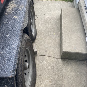 JM PRO Roofing - Here you can see the damage to the sidewalk. The spot under the tire sunk a lot - Roofing Near Me - Somerset, Kentucky JM PRO Roofing - Here you can see the damage to the sidewalk. The spot under the tire sunk a lot - Roofing Near Me - Somerset, Kentucky