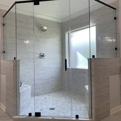 Custom glass shower enclosure by
Century Glass
281 499 9570