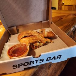 The Outlaw Saloon - Half the calzone to-go - good portion size